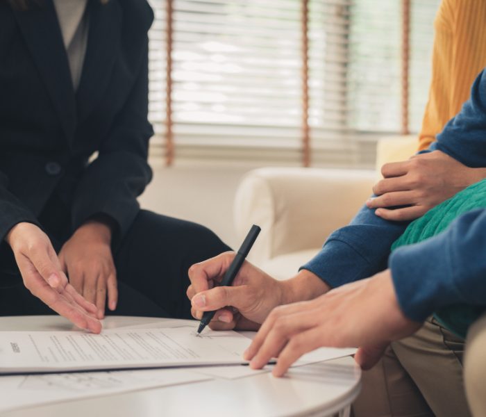 happy-young-asian-couple-realtor-agent