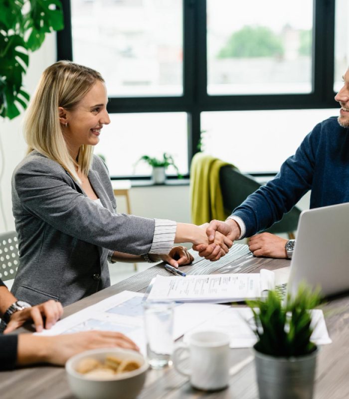 young-happy-couple-meeting-with-financial-advisor-office-woman-is-handshaking-with-agent young-happy-couple-meeting-with-financial-advisor-office-woman-is-handshaking-with-agent